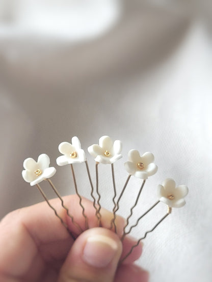 Pics à chignon fleur blanche en porcelaine