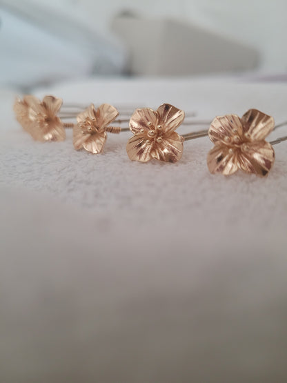 Pics à cheveux fleur dorée MIA